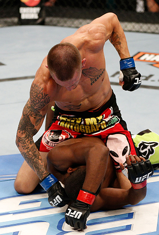 WINNIPEG, CANADA - JUNE 15: Dustin Pague (top) punches Yves Jabouin in their bantamweight fight during the UFC 161 event at the MTS Centre on June 15, 2013 in Winnipeg, Manitoba, Canada. (Photo by Josh Hedges/Zuffa LLC/Zuffa LLC via Getty Images)