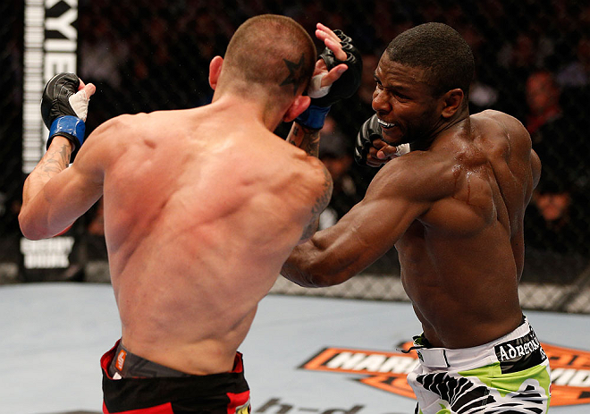 WINNIPEG, CANADA - JUNE 15: (R-L) Yves Jabouin punches Dustin Pague in their bantamweight fight during the UFC 161 event at the MTS Centre on June 15, 2013 in Winnipeg, Manitoba, Canada. (Photo by Josh Hedges/Zuffa LLC/Zuffa LLC via Getty Images)