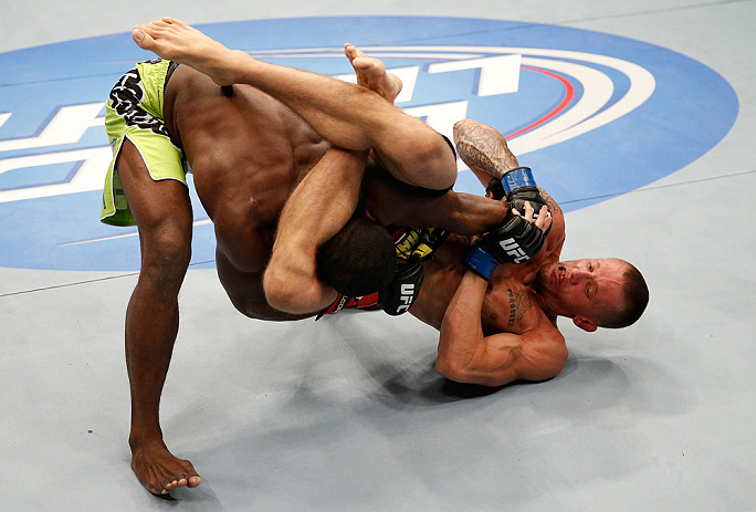 WINNIPEG, CANADA - JUNE 15: (R-L) Dustin Pague attempts a triangle choke submission against Yves Jabouin in their bantamweight fight during the UFC 161 event at the MTS Centre on June 15, 2013 in Winnipeg, Manitoba, Canada. (Photo by Josh Hedges/Zuffa L