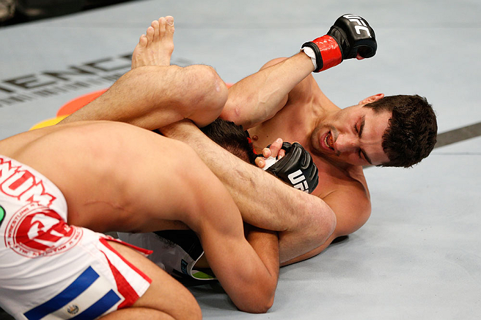 WINNIPEG, CANADA - JUNE 15: (R-L) Roland Delorme elbows Edwin Figueroa in their bantamweight fight during the UFC 161 event at the MTS Centre on June 15, 2013 in Winnipeg, Manitoba, Canada. (Photo by Josh Hedges/Zuffa LLC/Zuffa LLC via Getty Images)