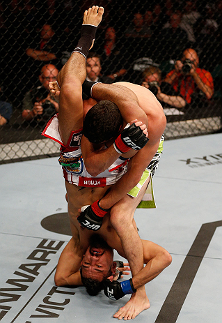 WINNIPEG, CANADA - JUNE 15: Edwin Figueroa (bottom) attempts to secure a triangle choke submission against Roland Delorme in their bantamweight fight during the UFC 161 event at the MTS Centre on June 15, 2013 in Winnipeg, Manitoba, Canada. (Photo by Jo