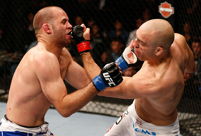 WINNIPEG, CANADA - JUNE 15: (R-L) Sean Pierson punches Kenny Robertson in their welterweight fight during the UFC 161 event at the MTS Centre on June 15, 2013 in Winnipeg, Manitoba, Canada. (Photo by Josh Hedges/Zuffa LLC/Zuffa LLC via Getty Images)