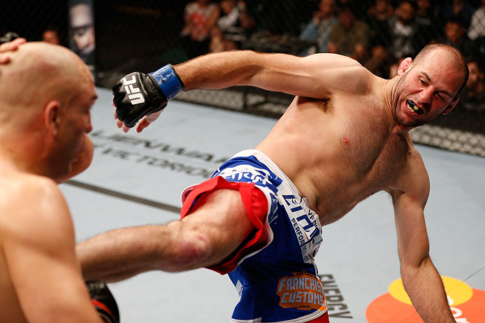 WINNIPEG, CANADA - JUNE 15: (R-L) Kenny Robertson kicks Sean Pierson in their welterweight fight during the UFC 161 event at the MTS Centre on June 15, 2013 in Winnipeg, Manitoba, Canada. (Photo by Josh Hedges/Zuffa LLC/Zuffa LLC via Getty Images)