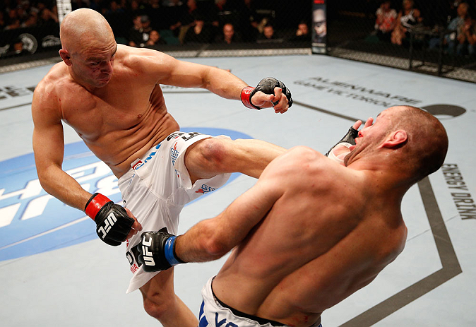 WINNIPEG, CANADA - JUNE 15: (L-R) Sean Pierson kicks Kenny Robertson in their welterweight fight during the UFC 161 event at the MTS Centre on June 15, 2013 in Winnipeg, Manitoba, Canada. (Photo by Josh Hedges/Zuffa LLC/Zuffa LLC via Getty Images)