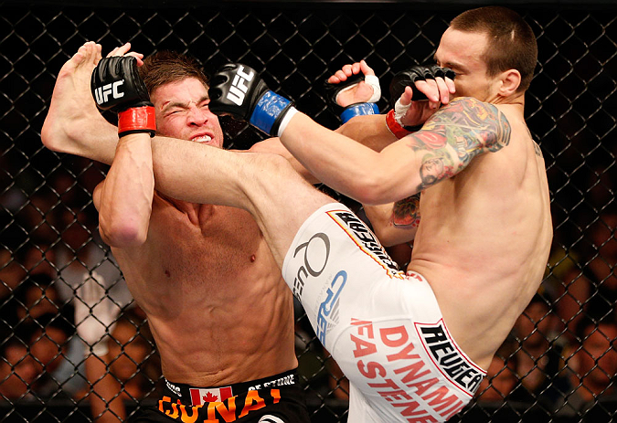 WINNIPEG, CANADA - JUNE 15: (R-L) James Krause kicks Sam Stout in their lightweight fight during the UFC 161 event at the MTS Centre on June 15, 2013 in Winnipeg, Manitoba, Canada. (Photo by Josh Hedges/Zuffa LLC/Zuffa LLC via Getty Images)