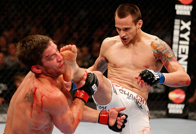WINNIPEG, CANADA - JUNE 15: (R-L) James Krause kicks Sam Stout in their lightweight fight during the UFC 161 event at the MTS Centre on June 15, 2013 in Winnipeg, Manitoba, Canada. (Photo by Josh Hedges/Zuffa LLC/Zuffa LLC via Getty Images)