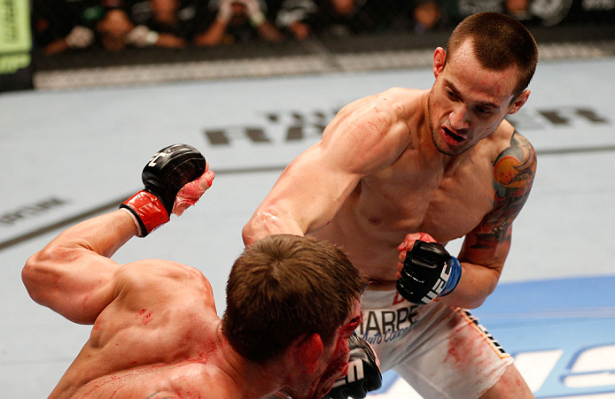 WINNIPEG, CANADA - JUNE 15: (R-L) James Krause punches Sam Stout in their lightweight fight during the UFC 161 event at the MTS Centre on June 15, 2013 in Winnipeg, Manitoba, Canada. (Photo by Josh Hedges/Zuffa LLC/Zuffa LLC via Getty Images)