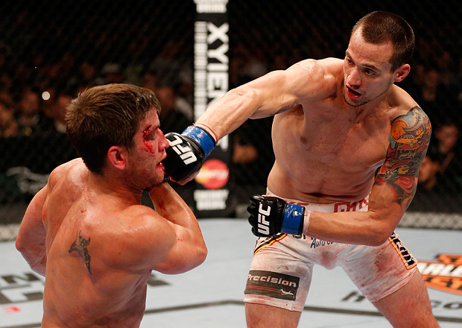 WINNIPEG, CANADA - JUNE 15: (R-L) James Krause punches Sam Stout in their lightweight fight during the UFC 161 event at the MTS Centre on June 15, 2013 in Winnipeg, Manitoba, Canada. (Photo by Josh Hedges/Zuffa LLC/Zuffa LLC via Getty Images)