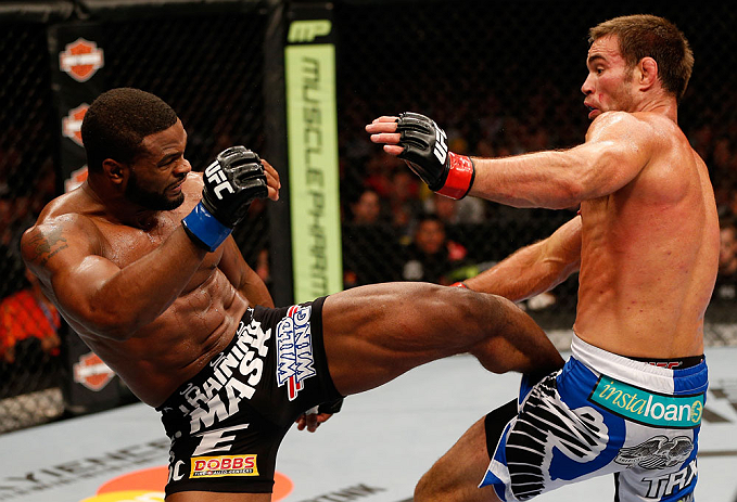WINNIPEG, CANADA - JUNE 15: (L-R) Tyron Woodley kicks Jake Shields in their welterweight fight during the UFC 161 event at the MTS Centre on June 15, 2013 in Winnipeg, Manitoba, Canada. (Photo by Josh Hedges/Zuffa LLC/Zuffa LLC via Getty Images)