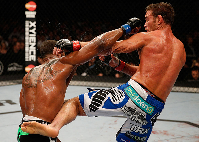 WINNIPEG, CANADA - JUNE 15: (R-L) Jake Shields and Tyron Woodley trade strikes in their welterweight fight during the UFC 161 event at the MTS Centre on June 15, 2013 in Winnipeg, Manitoba, Canada. (Photo by Josh Hedges/Zuffa LLC/Zuffa LLC via Getty Ima