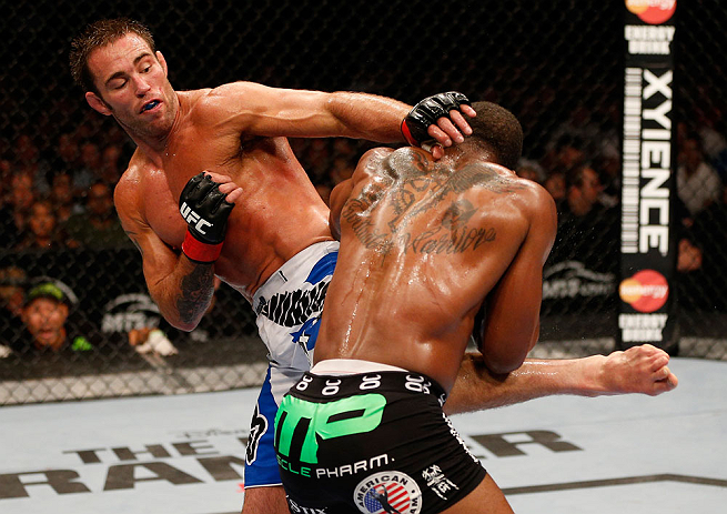 WINNIPEG, CANADA - JUNE 15: (L-R) Jake Shields kicks Tyron Woodley in their welterweight fight during the UFC 161 event at the MTS Centre on June 15, 2013 in Winnipeg, Manitoba, Canada. (Photo by Josh Hedges/Zuffa LLC/Zuffa LLC via Getty Images)