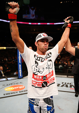WINNIPEG, CANADA - JUNE 15: Jake Shields reacts after his split decision victory over Tyron Woodley in their welterweight fight during the UFC 161 event at the MTS Centre on June 15, 2013 in Winnipeg, Manitoba, Canada. (Photo by Josh Hedges/Zuffa LLC/Zu