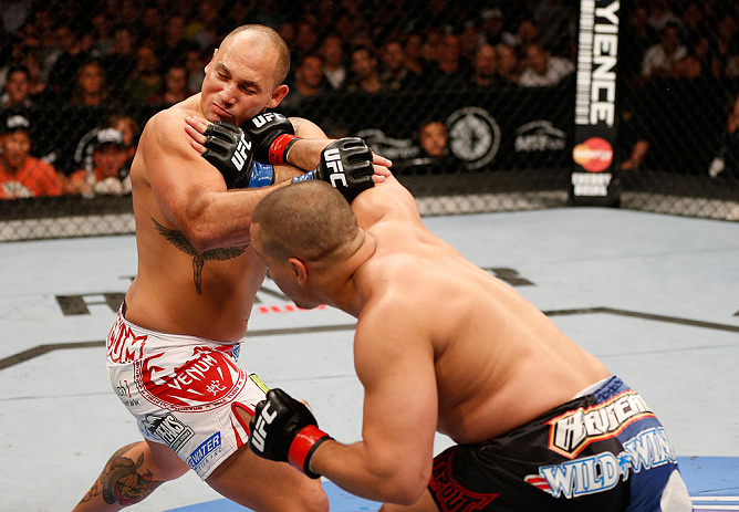 WINNIPEG, CANADA - JUNE 15: (R-L) Pat Barry punches Shawn Jordan in their heavyweight fight during the UFC 161 event at the MTS Centre on June 15, 2013 in Winnipeg, Manitoba, Canada. (Photo by Josh Hedges/Zuffa LLC/Zuffa LLC via Getty Images)