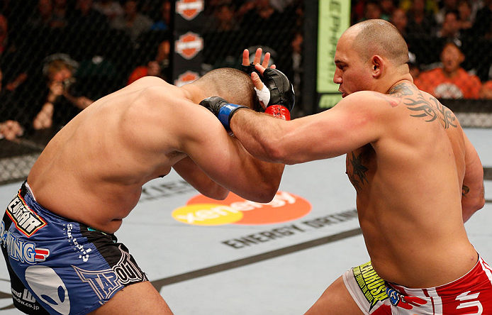 WINNIPEG, CANADA - JUNE 15: (R-L) Shawn Jordan punches Pat Barry in their heavyweight fight during the UFC 161 event at the MTS Centre on June 15, 2013 in Winnipeg, Manitoba, Canada. (Photo by Josh Hedges/Zuffa LLC/Zuffa LLC via Getty Images)
