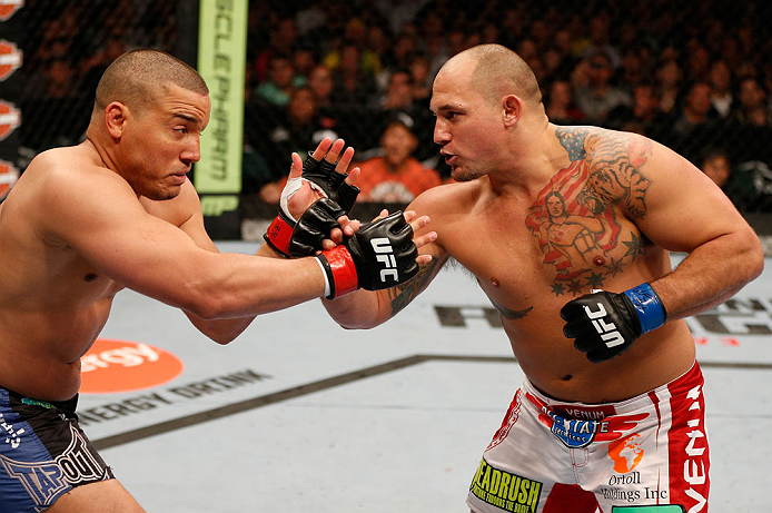 WINNIPEG, CANADA - JUNE 15: (R-L) Shawn Jordan punches Pat Barry in their heavyweight fight during the UFC 161 event at the MTS Centre on June 15, 2013 in Winnipeg, Manitoba, Canada. (Photo by Josh Hedges/Zuffa LLC/Zuffa LLC via Getty Images)