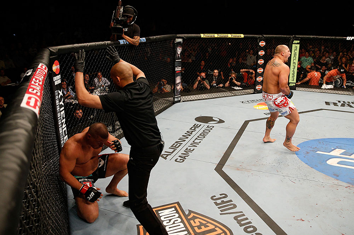 WINNIPEG, CANADA - JUNE 15: (R-L) Shawn Jordan reacts after knocking out Pat Barry in their heavyweight fight during the UFC 161 event at the MTS Centre on June 15, 2013 in Winnipeg, Manitoba, Canada. (Photo by Josh Hedges/Zuffa LLC/Zuffa LLC via Getty