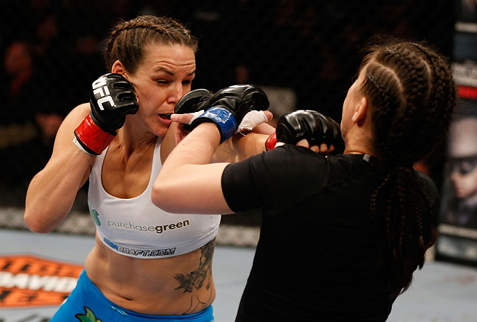 WINNIPEG, CANADA - JUNE 15: (L-R) Alexis Davis punches Rosi Sexton in their bantamweight fight during the UFC 161 event at the MTS Centre on June 15, 2013 in Winnipeg, Manitoba, Canada. (Photo by Josh Hedges/Zuffa LLC/Zuffa LLC via Getty Images)
