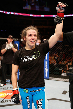 WINNIPEG, CANADA - JUNE 15: Alexis Davis reacts after defeating Rosi Sexton in their bantamweight fight during the UFC 161 event at the MTS Centre on June 15, 2013 in Winnipeg, Manitoba, Canada. (Photo by Josh Hedges/Zuffa LLC/Zuffa LLC via Getty Images