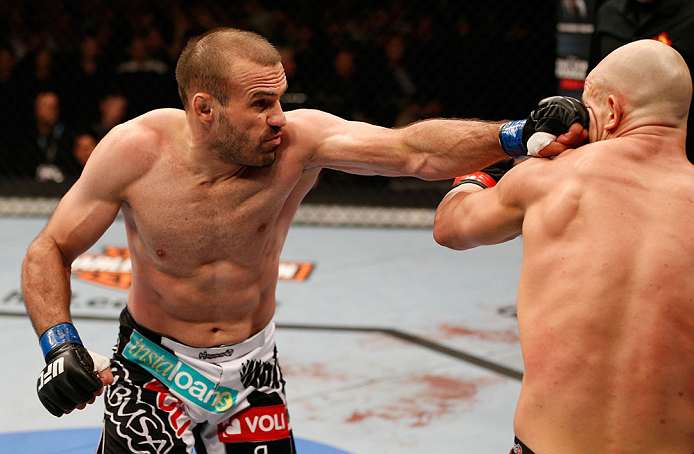 WINNIPEG, CANADA - JUNE 15: (L-R) Igor Pokrajac punches Ryan Jimmo in their light heavyweight fight during the UFC 161 event at the MTS Centre on June 15, 2013 in Winnipeg, Manitoba, Canada. (Photo by Josh Hedges/Zuffa LLC/Zuffa LLC via Getty Images)