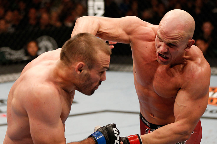WINNIPEG, CANADA - JUNE 15: (R-L) Ryan Jimmo punches Igor Pokrajac in their light heavyweight fight during the UFC 161 event at the MTS Centre on June 15, 2013 in Winnipeg, Manitoba, Canada. (Photo by Josh Hedges/Zuffa LLC/Zuffa LLC via Getty Images)
