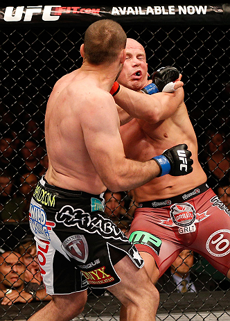 WINNIPEG, CANADA - JUNE 15: (L-R) Igor Pokrajac punches Ryan Jimmo in their light heavyweight fight during the UFC 161 event at the MTS Centre on June 15, 2013 in Winnipeg, Manitoba, Canada. (Photo by Josh Hedges/Zuffa LLC/Zuffa LLC via Getty Images)
