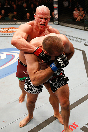 WINNIPEG, CANADA - JUNE 15: (L-R) Ryan Jimmo punches Igor Pokrajac in their light heavyweight fight during the UFC 161 event at the MTS Centre on June 15, 2013 in Winnipeg, Manitoba, Canada. (Photo by Josh Hedges/Zuffa LLC/Zuffa LLC via Getty Images)