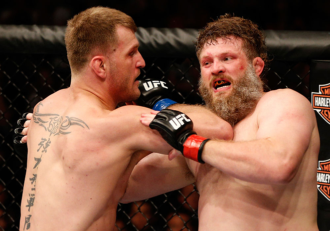 WINNIPEG, CANADA - JUNE 15: (L-R) Stipe Miocic elbows "Big Country" Roy Nelson in their heavyweight fight during the UFC 161 event at the MTS Centre on June 15, 2013 in Winnipeg, Manitoba, Canada. (Photo by Josh Hedges/Zuffa LLC/Zuffa LLC via Getty Imag