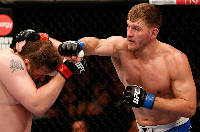 WINNIPEG, CANADA - JUNE 15: (R-L) Stipe Miocic punches "Big Country" Roy Nelson in their heavyweight fight during the UFC 161 event at the MTS Centre on June 15, 2013 in Winnipeg, Manitoba, Canada. (Photo by Josh Hedges/Zuffa LLC/Zuffa LLC via Getty Ima