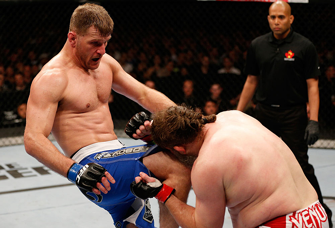 WINNIPEG, CANADA - JUNE 15: (L-R) Stipe Miocic knees "Big Country" Roy Nelson in their heavyweight fight during the UFC 161 event at the MTS Centre on June 15, 2013 in Winnipeg, Manitoba, Canada. (Photo by Josh Hedges/Zuffa LLC/Zuffa LLC via Getty Image