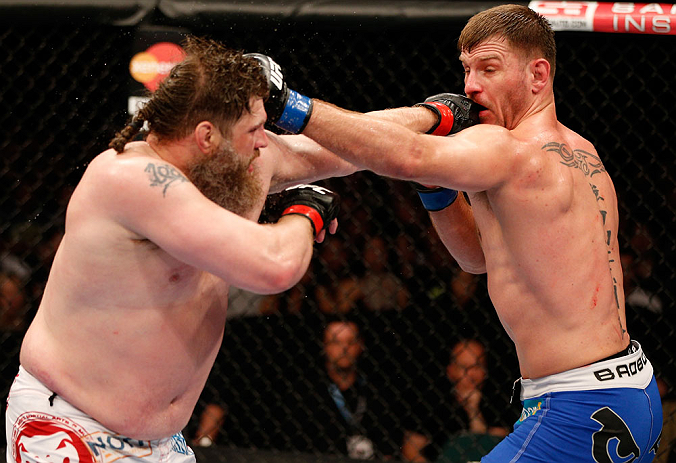WINNIPEG, CANADA - JUNE 15: (L-R) "Big Country" Roy Nelson and Stipe Miocic trade punches in their heavyweight fight during the UFC 161 event at the MTS Centre on June 15, 2013 in Winnipeg, Manitoba, Canada. (Photo by Josh Hedges/Zuffa LLC/Zuffa LLC via