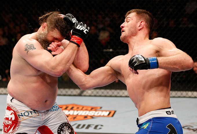 WINNIPEG, CANADA - JUNE 15: (R-L) Stipe Miocic punches "Big Country" Roy Nelson in their heavyweight fight during the UFC 161 event at the MTS Centre on June 15, 2013 in Winnipeg, Manitoba, Canada. (Photo by Josh Hedges/Zuffa LLC/Zuffa LLC via Getty Ima