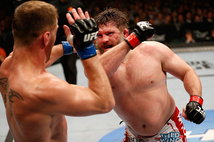 WINNIPEG, CANADA - JUNE 15: (R-L) "Big Country" Roy Nelson punches Stipe Miocic in their heavyweight fight during the UFC 161 event at the MTS Centre on June 15, 2013 in Winnipeg, Manitoba, Canada. (Photo by Josh Hedges/Zuffa LLC/Zuffa LLC via Getty Ima