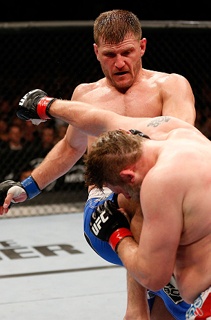 WINNIPEG, CANADA - JUNE 15: (L-R) Stipe Miocic knees Roy Nelson in their heavyweight fight during the UFC 161 event at the MTS Centre on June 15, 2013 in Winnipeg, Manitoba, Canada. (Photo by Josh Hedges/Zuffa LLC/Zuffa LLC via Getty Images)