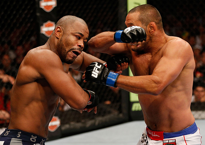 WINNIPEG, CANADA - JUNE 15: (R-L) Dan Henderson punches Rashad Evans in their light heavyweight fight during the UFC 161 event at the MTS Centre on June 15, 2013 in Winnipeg, Manitoba, Canada. (Photo by Josh Hedges/Zuffa LLC/Zuffa LLC via Getty Images)