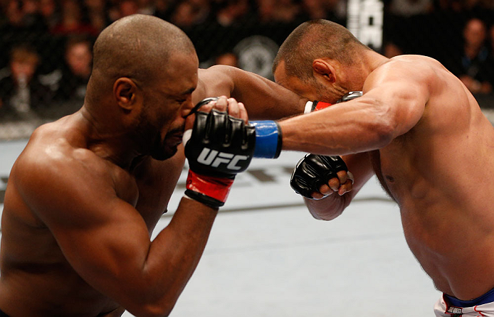 WINNIPEG, CANADA - JUNE 15: (R-L) Dan Henderson and Rashad Evans trade punches in their light heavyweight fight during the UFC 161 event at the MTS Centre on June 15, 2013 in Winnipeg, Manitoba, Canada. (Photo by Josh Hedges/Zuffa LLC/Zuffa LLC via Gett