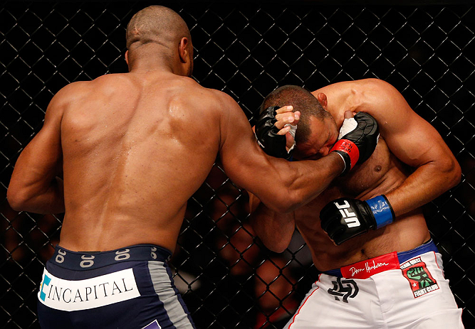 WINNIPEG, CANADA - JUNE 15: (L-R) Rashad Evans punches Dan Henderson in their light heavyweight fight during the UFC 161 event at the MTS Centre on June 15, 2013 in Winnipeg, Manitoba, Canada. (Photo by Josh Hedges/Zuffa LLC/Zuffa LLC via Getty Images)