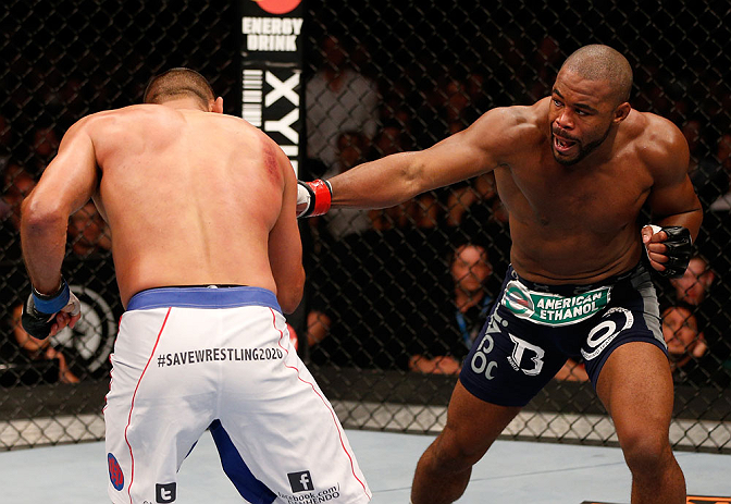 WINNIPEG, CANADA - JUNE 15: (R-L) Rashad Evans punches Dan Henderson in their light heavyweight fight during the UFC 161 event at the MTS Centre on June 15, 2013 in Winnipeg, Manitoba, Canada. (Photo by Josh Hedges/Zuffa LLC/Zuffa LLC via Getty Images)