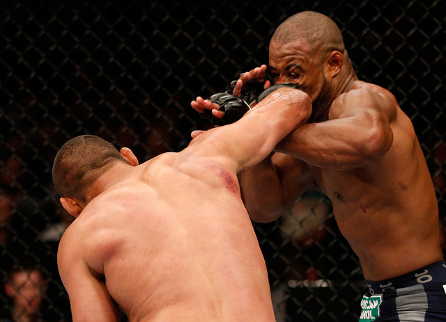 WINNIPEG, CANADA - JUNE 15: (L-R) Dan Henderson punches Rashad Evans in their light heavyweight fight during the UFC 161 event at the MTS Centre on June 15, 2013 in Winnipeg, Manitoba, Canada. (Photo by Josh Hedges/Zuffa LLC/Zuffa LLC via Getty Images)