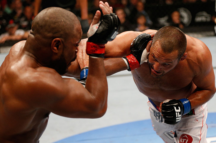 WINNIPEG, CANADA - JUNE 15: (R-L) Dan Henderson punches Rashad Evans in their light heavyweight fight during the UFC 161 event at the MTS Centre on June 15, 2013 in Winnipeg, Manitoba, Canada. (Photo by Josh Hedges/Zuffa LLC/Zuffa LLC via Getty Images)