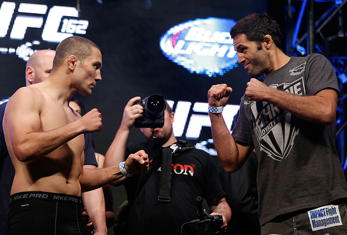 LAS VEGAS, NV - JULY 05: (L-R) Opponents Mike Pierce and David Mitchell face off during the UFC 162 weigh-in at the Mandalay Bay Events Center on July 5, 2013 in Las Vegas, Nevada. (Photo by Josh Hedges/Zuffa LLC/Zuffa LLC via Getty Images)