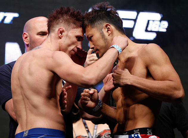 LAS VEGAS, NV - JULY 05: (L-R) Opponents Norman Parke and Kazuki Tokudome face off during the UFC 162 weigh-in at the Mandalay Bay Events Center on July 5, 2013 in Las Vegas, Nevada. (Photo by Josh Hedges/Zuffa LLC/Zuffa LLC via Getty Images)