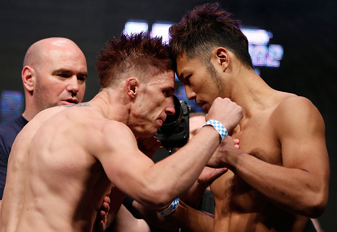 LAS VEGAS, NV - JULY 05: (L-R) Opponents Norman Parke and Kazuki Tokudome face off during the UFC 162 weigh-in at the Mandalay Bay Events Center on July 5, 2013 in Las Vegas, Nevada. (Photo by Josh Hedges/Zuffa LLC/Zuffa LLC via Getty Images)