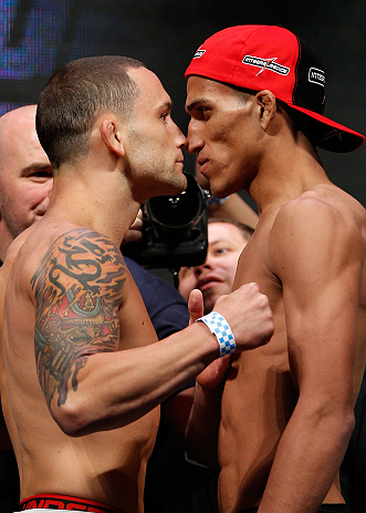 LAS VEGAS, NV - JULY 05: (L-R) Opponents Frankie Edgar and Charles Oliveira face off during the UFC 162 weigh-in at the Mandalay Bay Events Center on July 5, 2013 in Las Vegas, Nevada. (Photo by Josh Hedges/Zuffa LLC/Zuffa LLC via Getty Images)