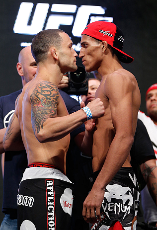 LAS VEGAS, NV - JULY 05: (L-R) Opponents Frankie Edgar and Charles Oliveira face off during the UFC 162 weigh-in at the Mandalay Bay Events Center on July 5, 2013 in Las Vegas, Nevada. (Photo by Josh Hedges/Zuffa LLC/Zuffa LLC via Getty Images)