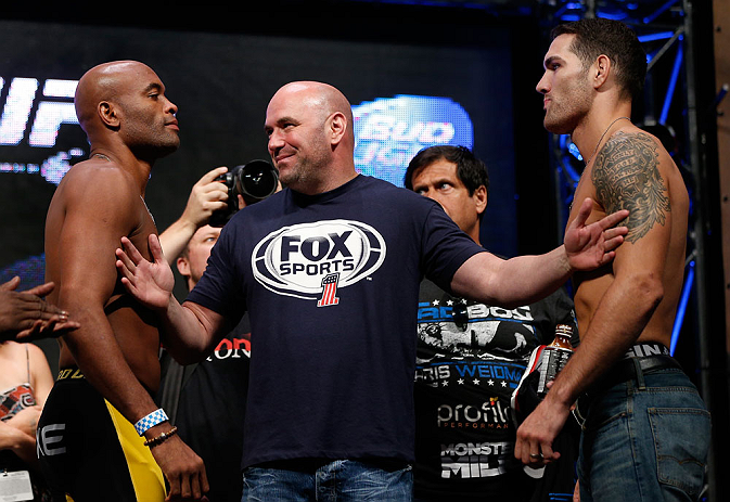 LAS VEGAS, NV - JULY 05: Opponents Anderson Silva (L) and Chris Weidman (R) are separated by UFC president Dana White during the UFC 162 weigh-in at the Mandalay Bay Events Center on July 5, 2013 in Las Vegas, Nevada. (Photo by Josh Hedges/Zuffa LLC/Zuf