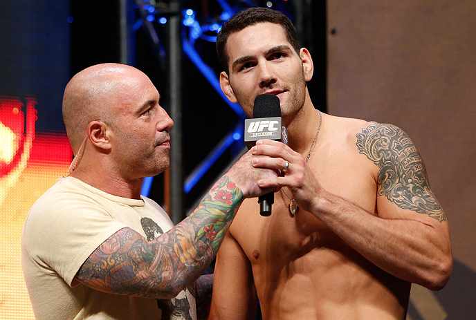 LAS VEGAS, NV - JULY 05: (R-L) Chris Weidman is interviewed by Joe Rogan after weighing in during the UFC 162 weigh-in at the Mandalay Bay Events Center on July 5, 2013 in Las Vegas, Nevada. (Photo by Josh Hedges/Zuffa LLC/Zuffa LLC via Getty Images)