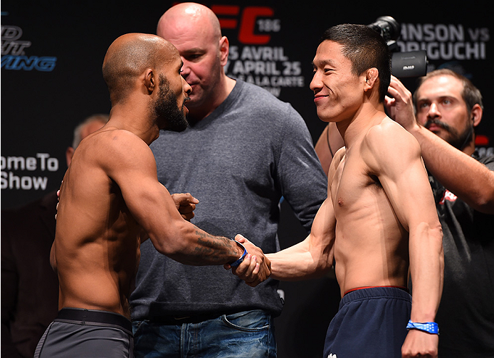 MONTREAL, QC - APRIL 24: (L-R) Opponents Demetrious Johnson of the United States and Kyoji Horiguchi of Japan face off during the UFC 186 weigh-in at Metropolis on April 24, 2015 in Montreal, Quebec, Canada. (Photo by Josh Hedges/Zuffa LLC/Zuffa LLC via