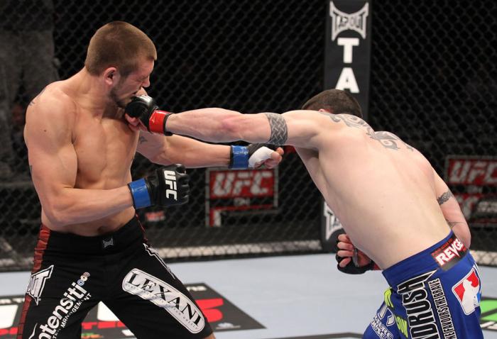 CHICAGO, IL - JANUARY 28: (R-L) Chris Camozzi punches Dustin Jacoby during the UFC on FOX event at United Center on January 28, 2012 in Chicago, Illinois. (Photo by Nick Laham/Zuffa LLC/Zuffa LLC via Getty Images) *** Local Caption *** Chris Camozzi; Du