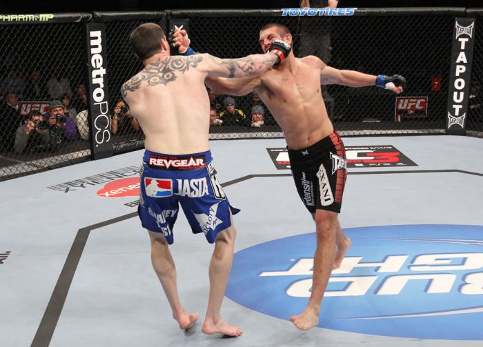 CHICAGO, IL - JANUARY 28: (R-L) Dustin Jacoby and Chris Camozzi trade punches during the UFC on FOX event at United Center on January 28, 2012 in Chicago, Illinois. (Photo by Nick Laham/Zuffa LLC/Zuffa LLC via Getty Images) *** Local Caption *** Chris C