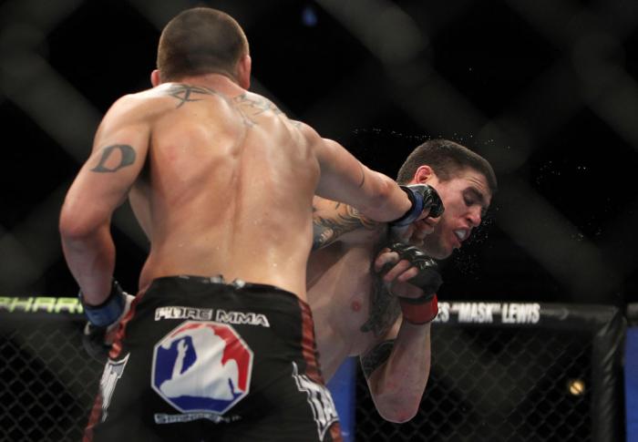 CHICAGO, IL - JANUARY 28: (L-R) Dustin Jacoby punches Chris Camozzi during the UFC on FOX event at United Center on January 28, 2012 in Chicago, Illinois. (Photo by Josh Hedges/Zuffa LLC/Zuffa LLC via Getty Images) *** Local Caption *** Chris Camozzi; D